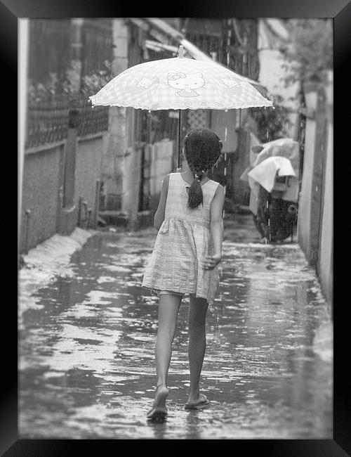 Girl In Rain Framed Print by Clive Eariss