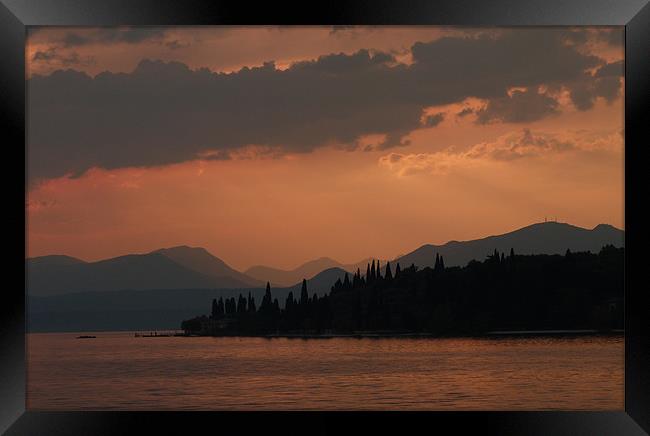 Sunset lake Garda Framed Print by Lynn hanlon