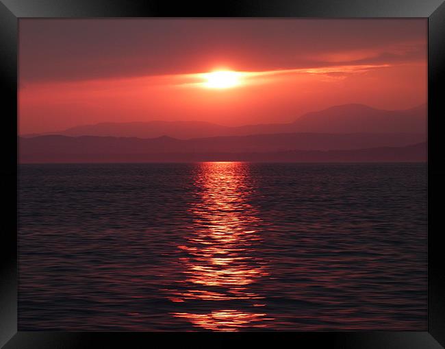 Sunset on lake Garda Framed Print by Lynn hanlon