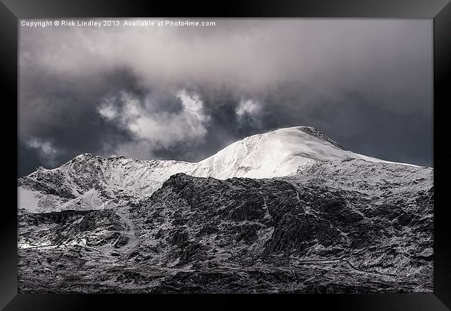 Storm over the moutains Framed Print by Rick Lindley