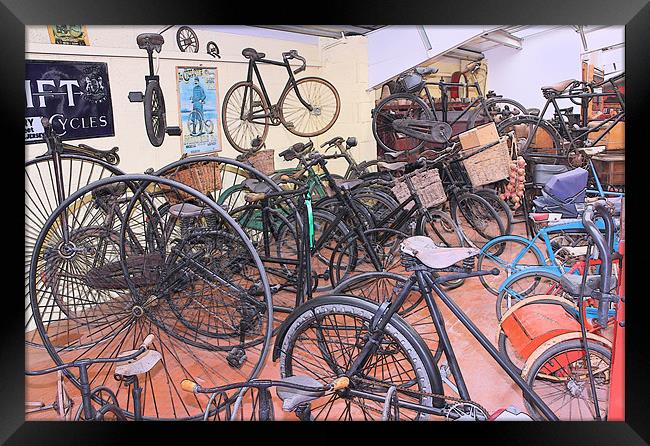 A Muddle of Old Bicycles Framed Print by Julie Ormiston