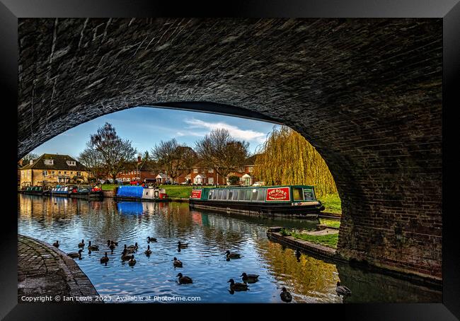 Peaceful Haven Underneath the Bridge Framed Print by Ian Lewis
