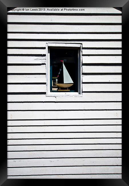 Model Boat In A Window Framed Print by Ian Lewis