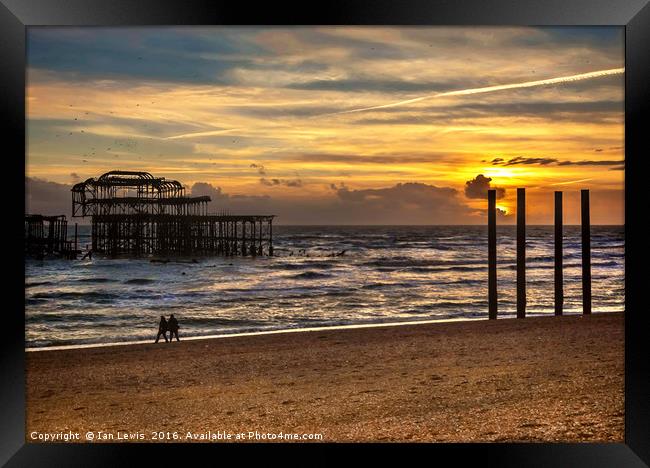 Sunset Over The West Pier Framed Print by Ian Lewis