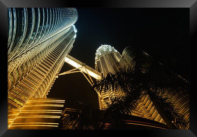 Petronas Towers in colour cast Framed Print by Paul Fisher