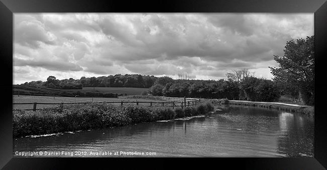 Canal on a cloudy day Black and White Framed Print by Daniel Fong