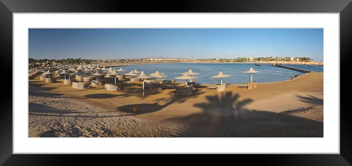Beach sand and sea with sunbeds and parasols  Framed Mounted Print by mark humpage