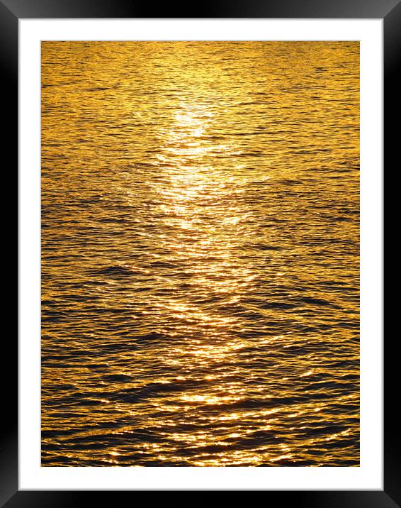 Golden sunset reflections over water Framed Mounted Print by mark humpage