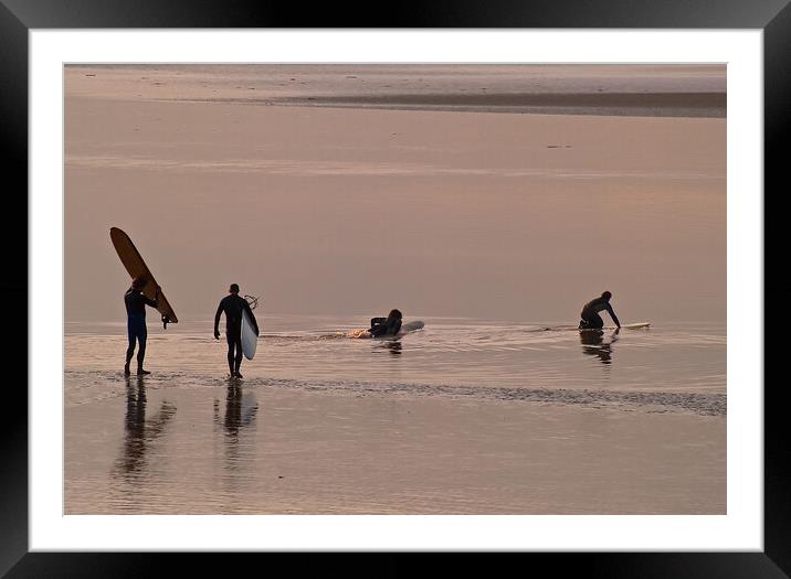 Surfers walking out to water with surfboards Framed Mounted Print by mark humpage