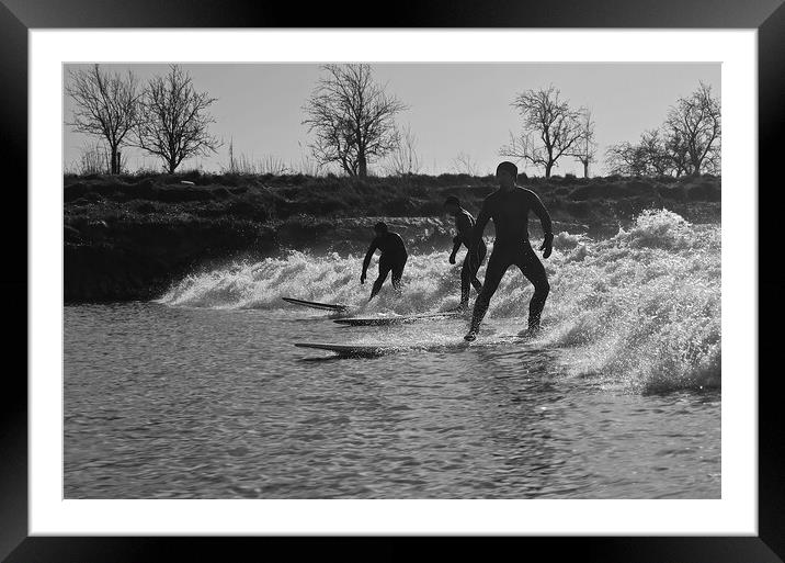 Surfers riding a wave on the river Severn Framed Mounted Print by mark humpage