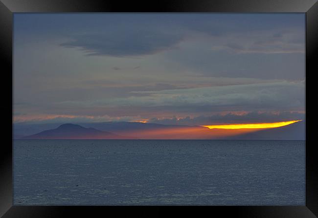 Holy Isle Sunset Rays Framed Print by David Hancox