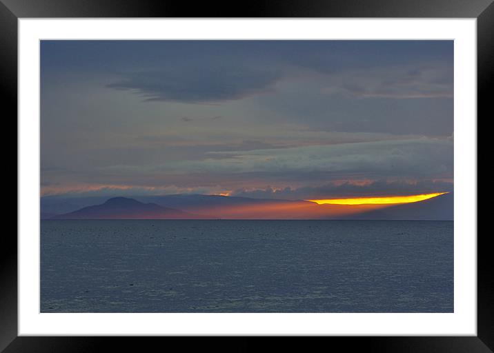 Holy Isle Sunset Rays Framed Mounted Print by David Hancox