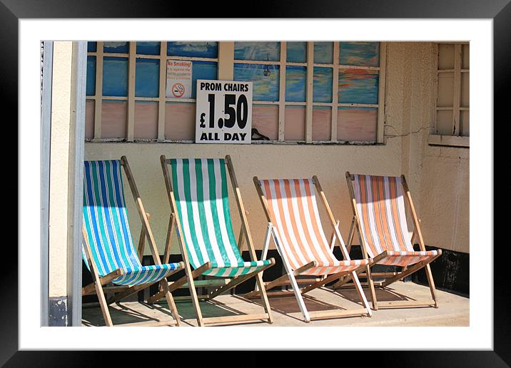vacant deckchairs awaiting occupation Framed Mounted Print by dennis brown