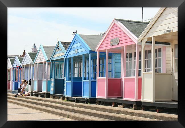 East Anglian beach huts Framed Print by dennis brown