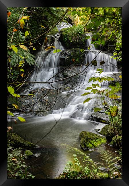 Cascading Waterfall's Tranquil Beauty Framed Print by John Hastings