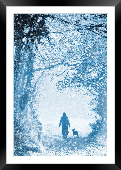 Shepherd and dog in the snow Framed Mounted Print by Maggie McCall