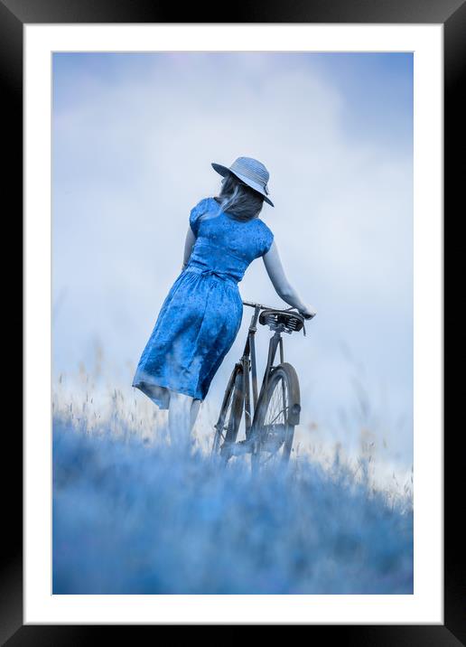 woman with bicycle in field Framed Mounted Print by Maggie McCall