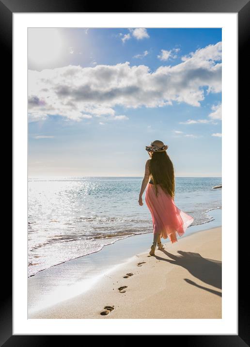 Rear view of a young woman on a beach Framed Mounted Print by Maggie McCall