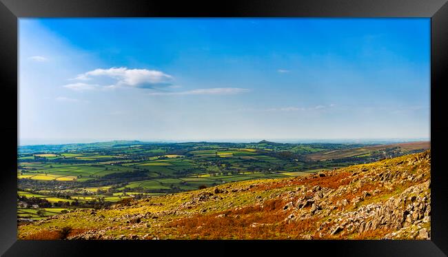 Brentor and Cornwall from Cox Tor, Dartmoor. Framed Print by Maggie McCall