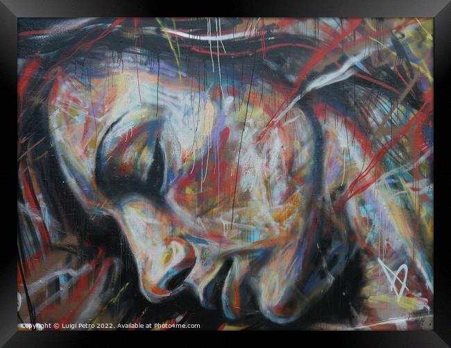 Graffiti depicting a female face Framed Print by Luigi Petro