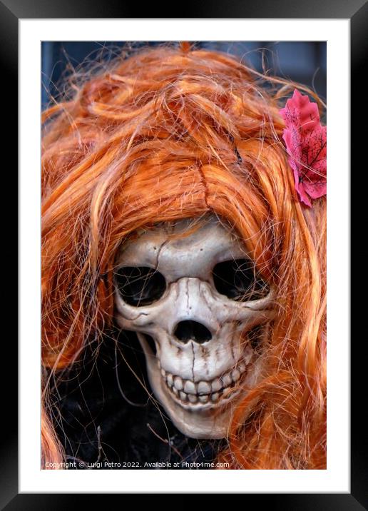 Skull wearing an orange wig. Framed Mounted Print by Luigi Petro
