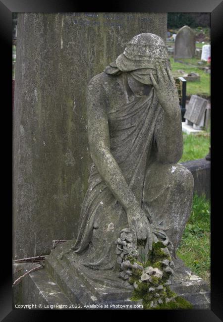 Statue of grieving  woman on a grave. Framed Print by Luigi Petro