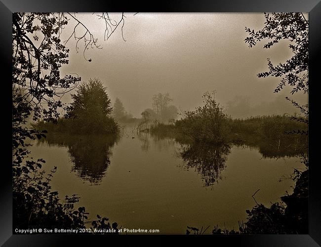 Foggy morning over the lake Framed Print by Sue Bottomley
