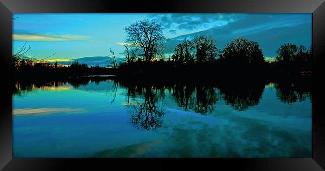 Sunrise over the lake Framed Print by Sue Bottomley