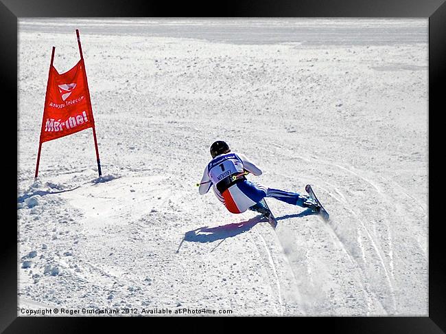 Downhill Alpine Ski Racer Framed Print by Roger Cruickshank