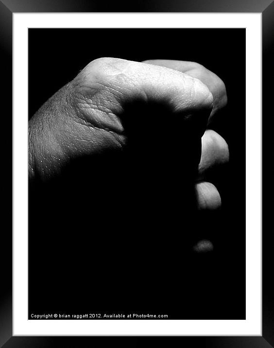 The Angry Fist Framed Mounted Print by Brian  Raggatt