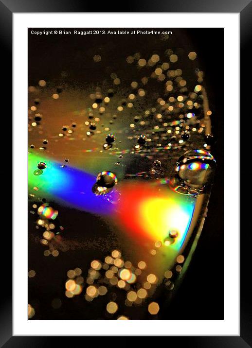Water Drop Disc- Glow Framed Mounted Print by Brian  Raggatt