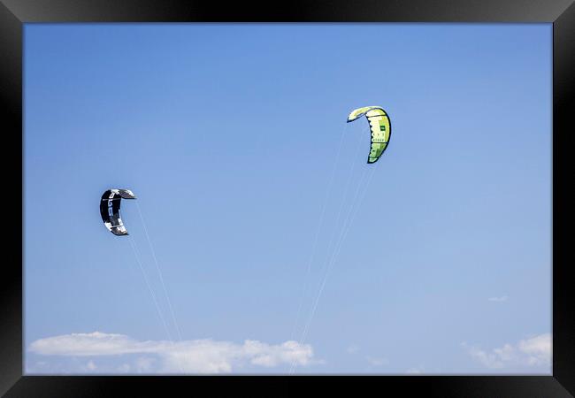 Kites against a blue sky Framed Print by Phil Crean