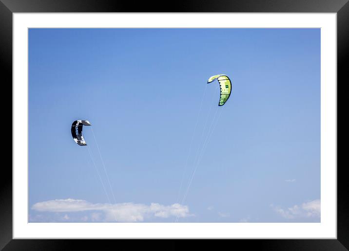 Kites against a blue sky Framed Mounted Print by Phil Crean