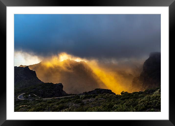 Golden rays of sunshine through the rainclouds Framed Mounted Print by Phil Crean