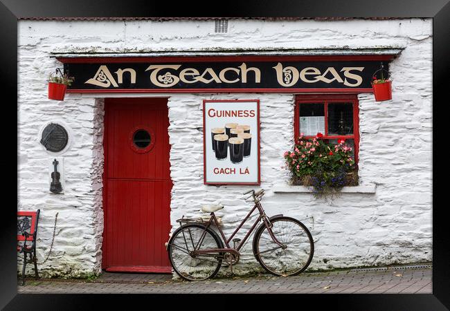 Bicycle outside pub, West Cork, Ireland Framed Print by Phil Crean