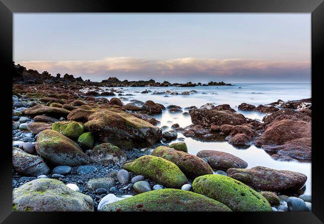Green stones on the west coast at dawn, Tenerife Framed Print by Phil Crean