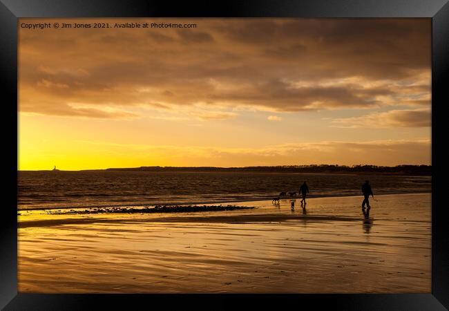 Dog walkers on the beach at sunrise Framed Print by Jim Jones