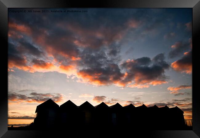 Silhouetted Beach Huts at Blyth (2) Framed Print by Jim Jones