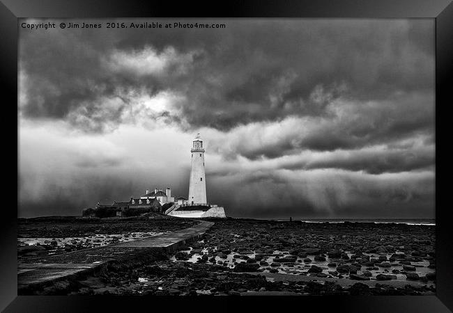 Storm clouds over St Mary's Island Framed Print by Jim Jones