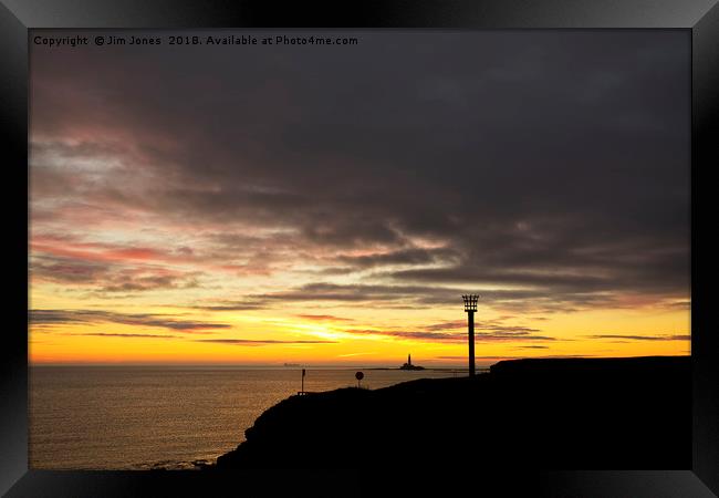 Beacon silhouetted against a dawn sky Framed Print by Jim Jones