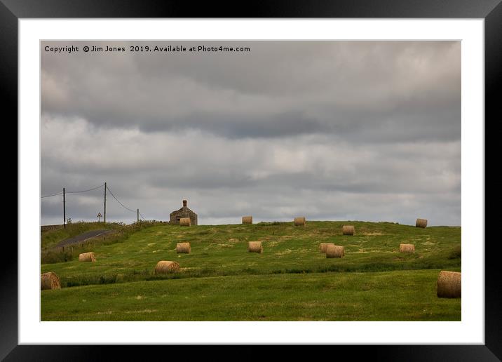 Hay Bales under an overcast sky Framed Mounted Print by Jim Jones