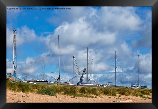 Yachts and Cranes behind the dunes Framed Print by Jim Jones