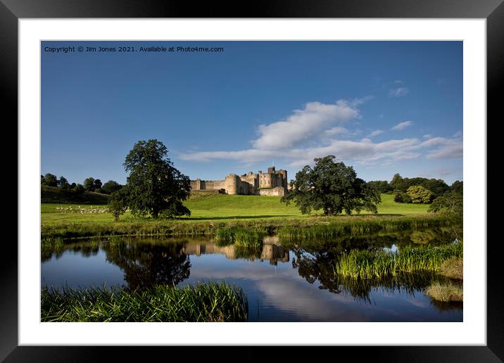 Alnwick Castle reflected in the River Aln. Framed Mounted Print by Jim Jones