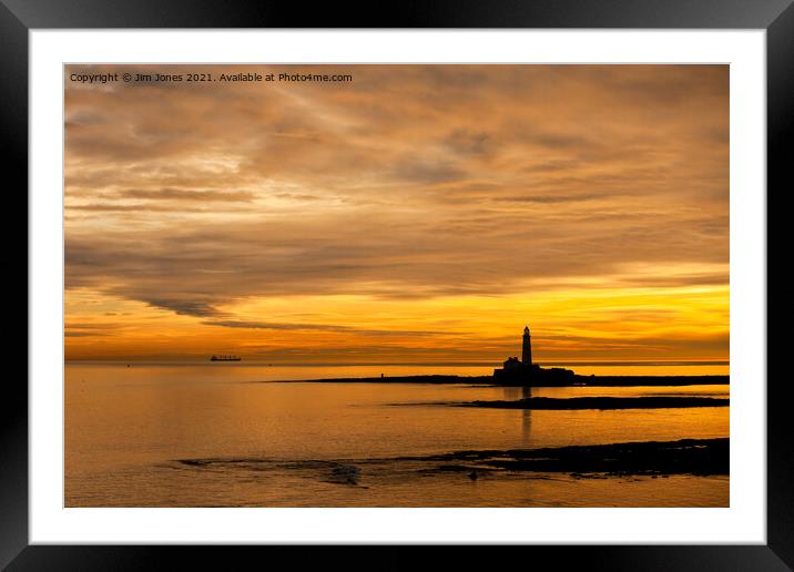 Silhouetted St Mary's Island at dawn Framed Mounted Print by Jim Jones