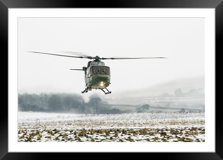 Army Lynx in the snow Framed Mounted Print by Ian Jones