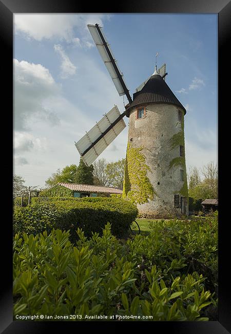 Windmill and a bicycle Framed Print by Ian Jones