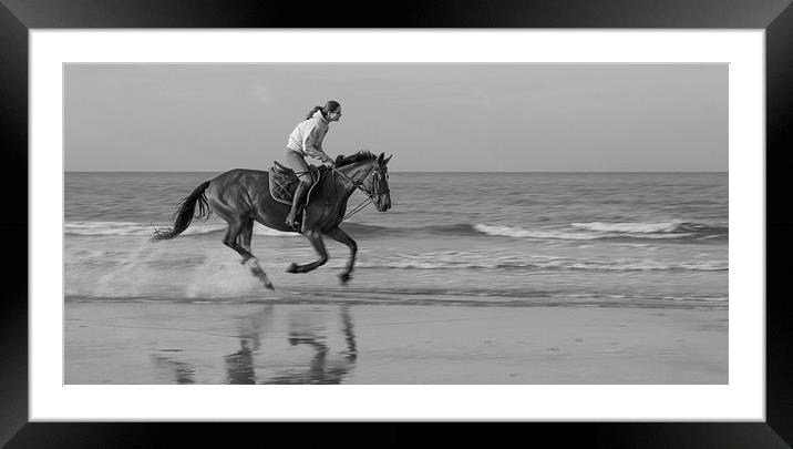 Galloping horse on a beach Framed Mounted Print by Ian Jones