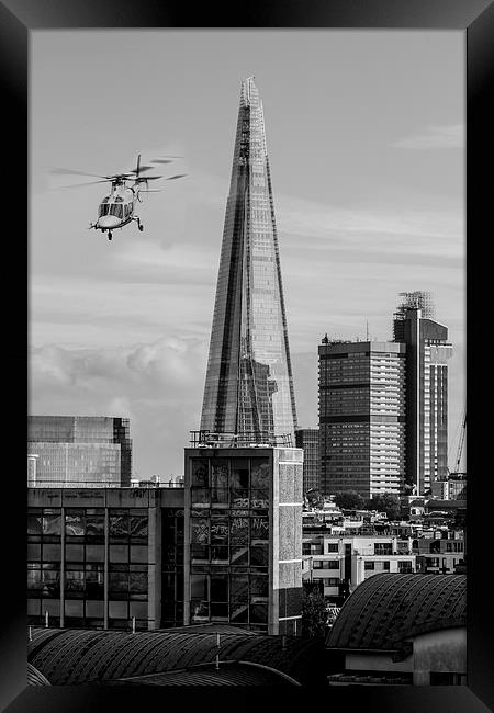 The Shard helicopter fly past Framed Print by Ian Jones