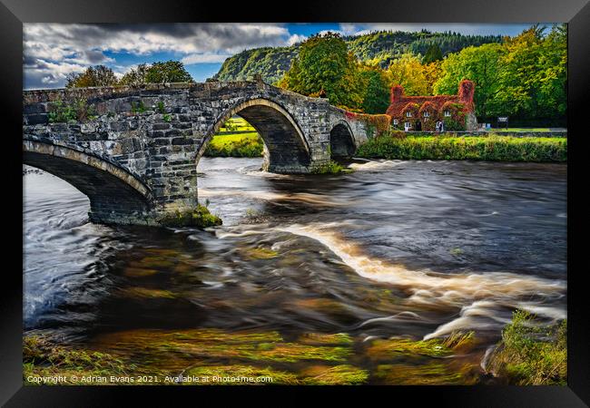 Llanrwst Cottage And Bridge Framed Print by Adrian Evans