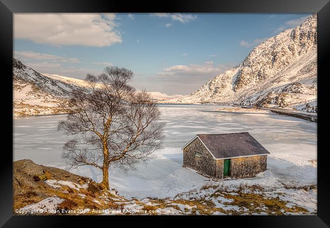 Frozen Llyn Ogwen Snowdonia  Framed Print by Adrian Evans